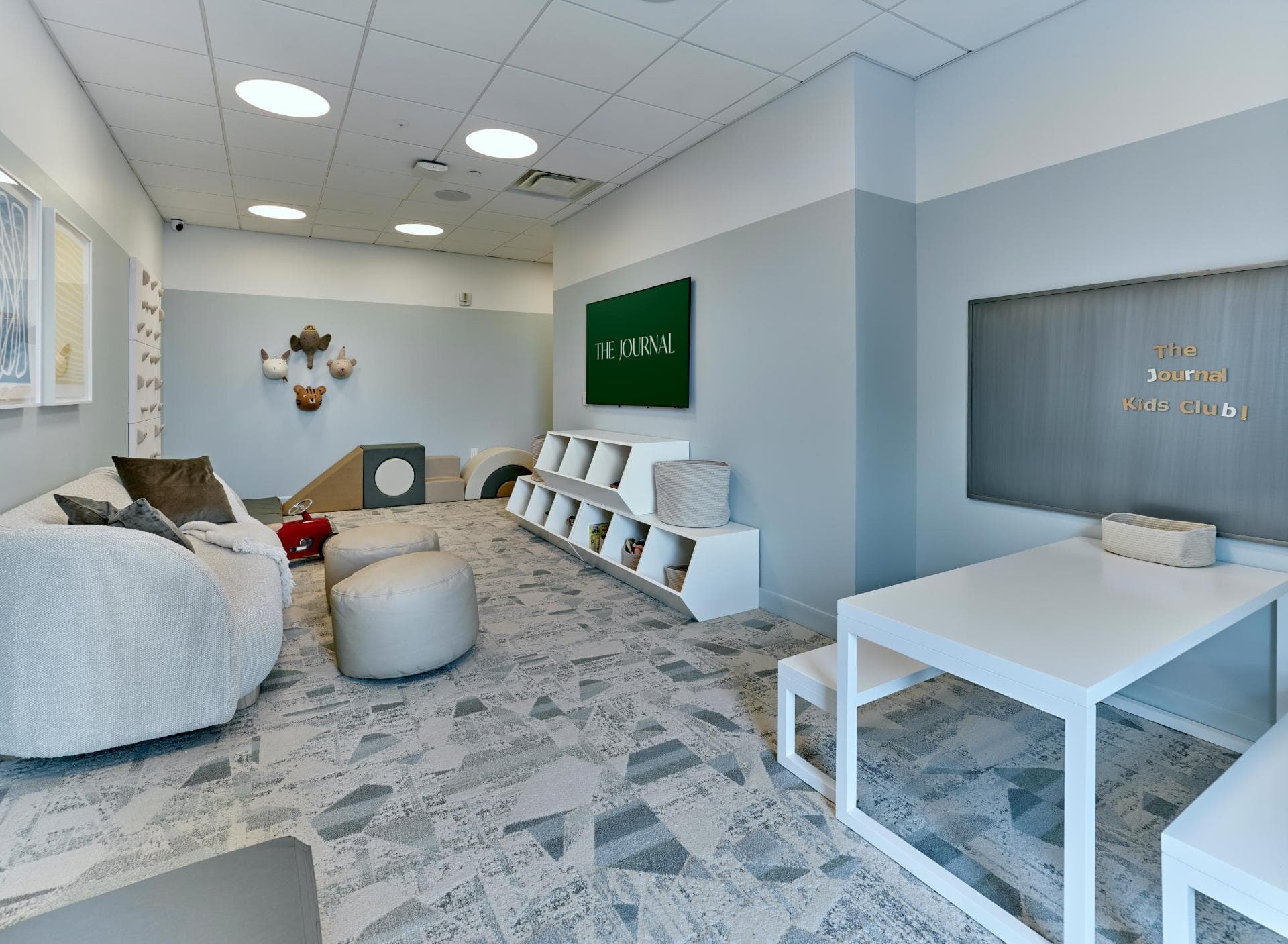 Child Playing In The Kids’ Club for Residents at The Journal